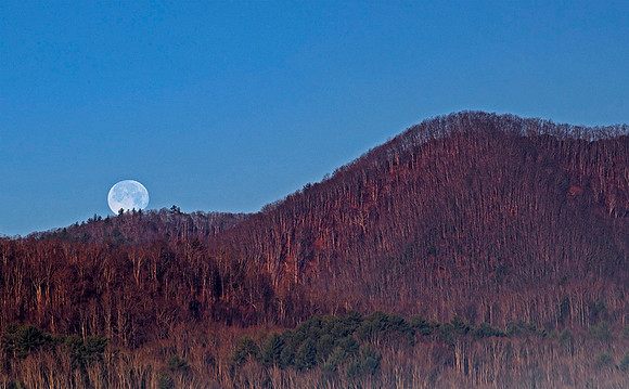 Supermoon setting at sunrise near Rocky Fork State Park, TN